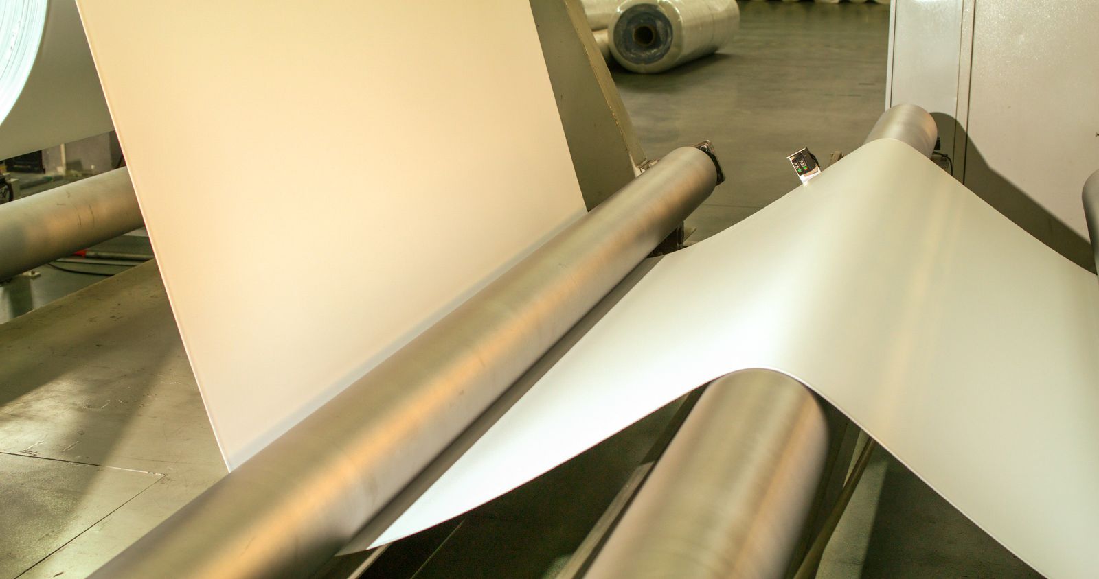 Belt web running through the coating line